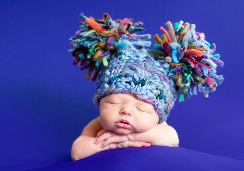 newborn baby wearing a hat