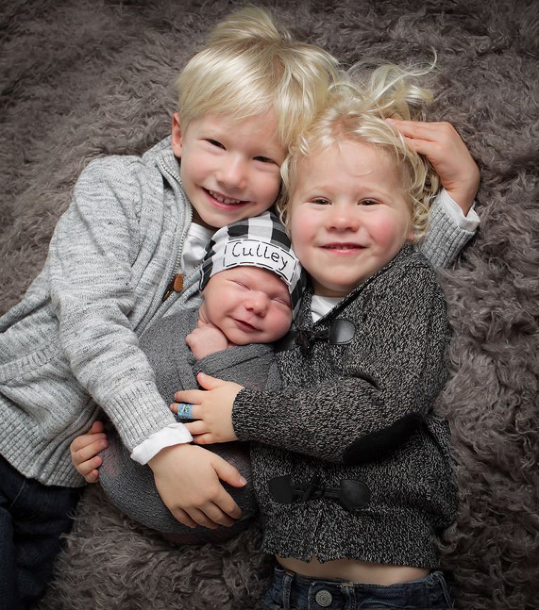 newborn baby with big brothers