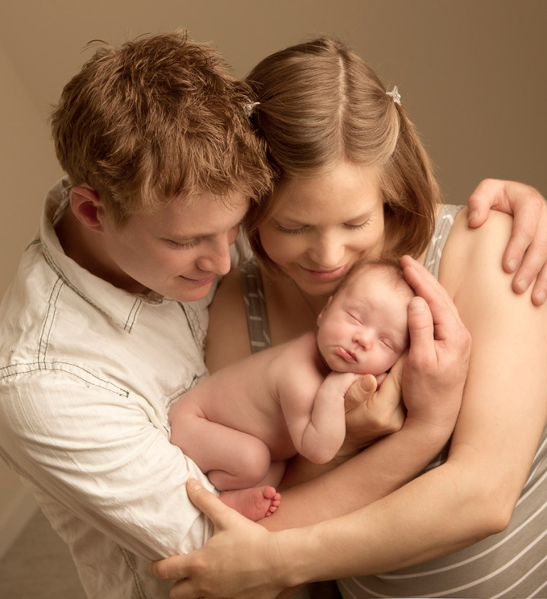 newborn baby with family